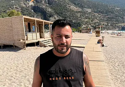 Fethiye'de şiddetli yağışların ardından tatilciler Belcekız'a akın etti